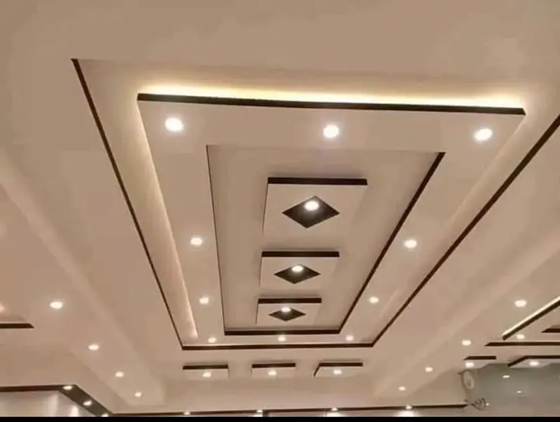 Layered POP false ceiling with cove lighting and recessed diamond light insets