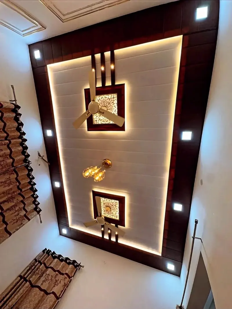 Panelled hall ceiling with dark timber border, backlit cove and decorative light boxes